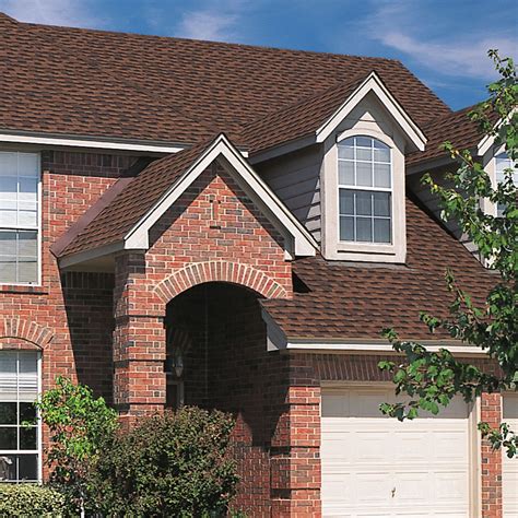 brick on metal house|matching brick and roof colors.